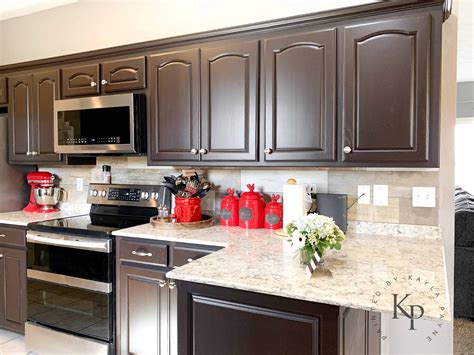 black stainless steel with espresso cabinets|dark brown espresso cabinets.